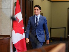 Prime Minister Justin Trudeau arrives for a news conference.