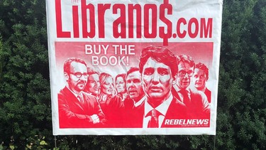 A lawn sign promoting a book by Ezra Levant.