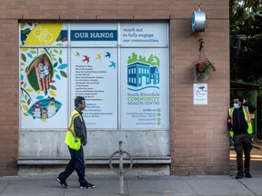 Security guards outside of The South Riverdale Community Health Centre in Leslieville where local resident Carolina Huber-Makurat was killed by a stray bullet across the street during an altercation, Friday August 18, 2023.