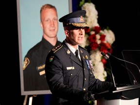 OPP Commissioner Thomas Carrique speaks at a funeral service.