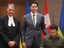 Ukrainian President Volodymyr Zelenskyy, Canadian Prime Minister Justin Trudeau, and Speaker of the House of Commons Anthony Rota (L) take part in a signing ceremony on Parliament Hill in Ottawa, Canada, on September 22, 2023.