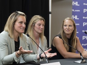 Canadian hockey players Marie-Philip Poulin, left, Laura Stacey, centre, and Ann-Renee Desbiens, are introduced by the Professional Women's Hockey League as the first three players to sign free agent contracts with the league's Montreal franchise in Montreal, Thursday, Sept. 7, 2023.