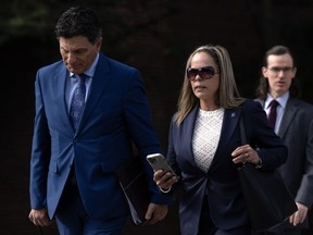 Tamara Lich walks with her lawyer Lawrence Greenspon as they make their way to the courthouse for trial, Wednesday, Sept. 13, 2023 in Ottawa.