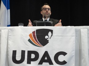 Quebec's anti-corruption unit says a former executive at a junior college north of Montreal is under arrest for defrauding the student union. UPAC Commissioner Frederick Gaudreau speaks at a news conference in Quebec City, Tuesday, Nov. 9, 2021.