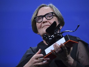Polish director Agnieszka Holland poses with the 'Special Jury Prize' award for 'Zielona Granica' after the closing ceremony for the 80th edition of the Venice Film Festival in Venice, Italy, Saturday, Sept. 9, 2023.