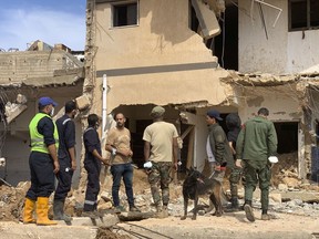 Rescue teams search for victims in Derna, Libya, on Sunday, Sept. 17, 2023. Libyan authorities have opened an investigation into the collapse of two dams that caused a devastating flood in a Derna as rescue teams searched for bodies on Saturday, nearly a week after the deluge killed more than 11,000 people.