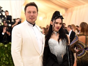 Elon Musk and Grimes attend the Heavenly Bodies Gala at The Met May 2018 - Getty