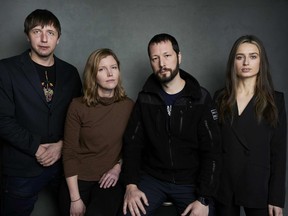 FILE - Photographer Evgeniy Maloletka, from left, "Frontline" producer/editor Michelle Mizner, director Mstyslav Chernov, and field producer Vasilisa Stepanenko pose for a portrait to promote the film "20 Days in Mariupol" at the Latinx House during the Sundance Film Festival on Sunday, Jan. 22, 2023, in Park City, Utah. The "Frontline" documentary collaboration with The Associated Press premieres on PBS on Nov. 21.