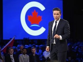 The first openly transgender person to run for the federal Conservatives warns that a policy adopted by the party could harm gender-diverse children if it ever becomes law. Conservative Leader Pierre Poilievre speaks to delegates at the Conservative Party Convention in Quebec City, Friday, Sept. 8, 2023.
