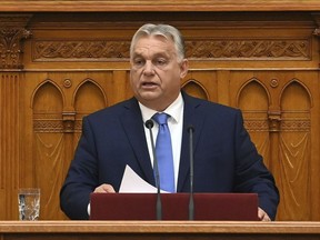 Hungarian Prime Minister Viktor Orban delivers his address on the opening day of the parliament's autumn session in Budapest, Hungary, Monday, Sept. 25, 2023.