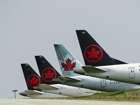 Unifor says 54 workers with Jazz Aviation in Newfoundland and Labrador are losing their jobs because of service changes made by Air Canada. Grounded Air Canada planes sit on the tarmac at Pearson International Airport, in Toronto, Wednesday, April 28, 2021.