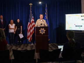 FILE - Las Vegas police Lt. Jason Johansson speaks during a news conference about a series of hit-and run-crashes Tuesday, Sept. 19, 2023, in Las Vegas. Two teenagers made very brief initial appearances Thursday, Sept. 21, in adult court in Las Vegas where a prosecutor said they will face murder, attempted murder and other charges after allegedly capturing themselves on video intentionally crashing a stolen car into a bicyclist pedaling along the side of a road -- killing him.