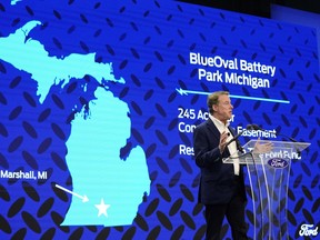 FILE - Ford Motor Co. Executive Chairman Bill Ford announces the automaker's new BlueOval Battery Park, Feb. 13, 2023, in Romulus, Mich. Ford Motor Co. said Monday, Sept. 25, that it's pausing construction of the $3.5 billion electric vehicle battery plant in Michigan until it is confident it can run the factory competitively.