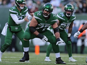 New York Jets guard Laurent Duvernay-Tardif (72) blocks during the team's NFL football game against the New Orleans Saints on Dec. 12, 2021, in East Rutherford, N.J. Duvernay-Tardif is embarking on a new chapter of his life. The 32-year-old from Mont-Saint-Hilaire, Que., officially announced his retirement from professional football on Thursday morning.