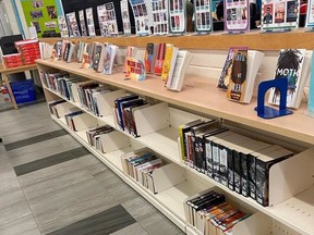 Empty shelves at the library at Erindale Secondary School in Mississauga, Ont. are shown in a handout photo. Ontario's minister of education says he has asked an Ontario public school board to immediately stop its new, and seemingly arbitrary practise of removing books that were published before 2008 from school libraries.