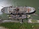 The retired BC Ferries vessel Queen of Sidney, top, that was in operation from 1960 to 2000, and another derelict vessel are seen moored on the Fraser River, in Mission, B.C., on Tuesday, July 18, 2023.