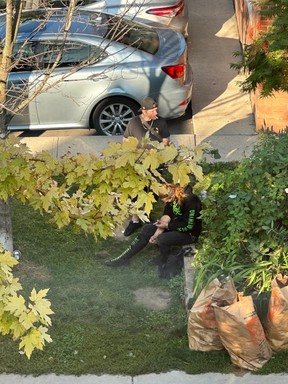 A pair of individuals shoot up on Aug. 31 outside the South Riverdale health centre.