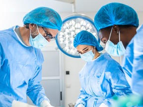 A surgical team at work in an operating room.