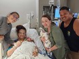 From left: Neva and Kelsey Benton and Amy and John Cardenas after the birth of Ezri Cardenas in July.