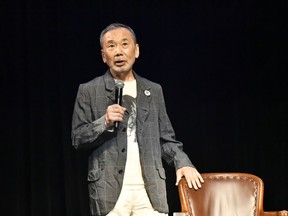 In this photo provided by The Waseda International House of Literature, Japanese novelist Haruki Murakami speaks during a ghost story reading event in Tokyo, Thursday, Sept. 28, 2023. Murakami hosted the event amid growing attention before the announcement of this year's Nobel Prize in literature, an award he is a perennial favorite to win. (The Waseda International House of Literature via AP)