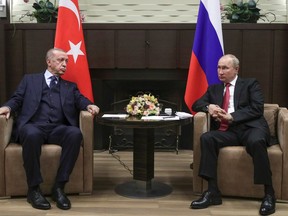 FILE - Russian President Vladimir Putin, right, and Turkish President Recep Tayyip Erdogan talk to each other during their meeting in the Bocharov Ruchei residence in the Black Sea resort of Sochi, Russia, Wednesday, Sept. 29, 2021. Turkish President Recep Tayyip Erdogan will meet with Vladimir Putin on Monday, Sept. 4, 2023 in a bid to persuade the Russian leader to rejoin the Black Sea grain deal that Moscow broke off from in July.