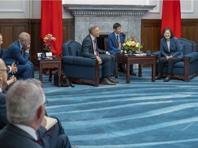 In this photo released by the Taiwan Presidential Office, Taiwan's President Tsai Ing-wen meets with Australian lawmaker Josh Wilson, third right and other lawmakers at the Presidential Office in Taipei, Taiwan, Tuesday, Sept. 26, 2023. (Taiwan Presidential Office via AP)