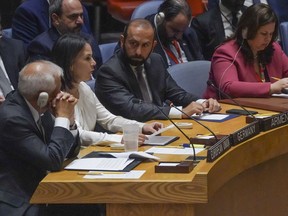 Armenia's Foreign Minister Ararat Mirzoyan, center, listen as Germany's Foreign Minister Annalena Baerbock, second from left, as she address a United Nations Security Council meeting on the conflict between Armenia and Azerbaijan, Thursday Sept. 21, 2023, at the United Nations headquarters.