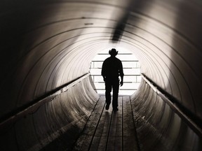 A person uses a pedestrian tunnel to get to the rodeo grounds at the Calgary Stampede in Calgary, Sunday, July 5, 2015.