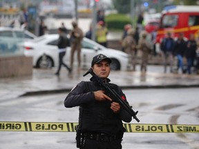 Members of Turkish Police Special Forces secure the area near the Interior Ministry following a bomb attack in Ankara, on October 1, 2023, leaving two police officers injured.