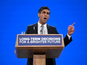 Britain's Prime Minister Rishi Sunak addresses delegates at the annual Conservative Party Conference in Manchester, northern England, on Oct. 4, 2023.