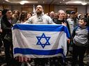 Members of Montreal's Jewish community gather for a vigil in Montreal on Oct. 9, 2023, after the Palestinian militant group Hamas launched an attack on Israel.