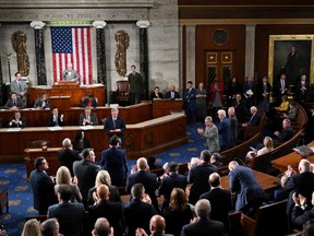 Republican members of the House of Representatives applaud as former U.S. House Speaker Kevin McCarthy, Republican of California, speaks before a third vote to elect a new speaker after he was ousted 17 days ago at the U.S. Capitol in Washington, D.C., on Oct. 19, 2023.