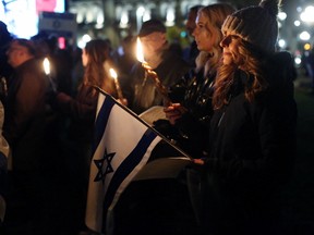 Members of the Jewish community hold a vigil for the more than 200 Israelis, including 30 children, held hostage by Hamas, on Parliament Hill in Ottawa, Ontario, Canada, on Oct. 28, 2023.