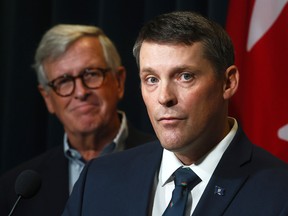 Alberta Finance Minister Nate Horner, right, and Jim Dinning.