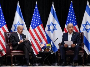 President Joe Biden and Israeli Prime Minister Benjamin Netanyahu participate in an expanded bilateral meeting with Israeli and U.S. government officials, Wednesday, Oct. 18, 2023, in Tel Aviv.