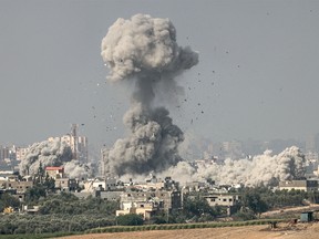 A photo taken from the southern Israeli city of Sderot on Oct. 23, 2023, shows smoke and debris ascending over the northern Gaza Strip following an Israeli airstrike, amid the ongoing war between Israel and the Hamas terrorist group.