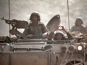 Israeli soldiers in an armored vehicle.