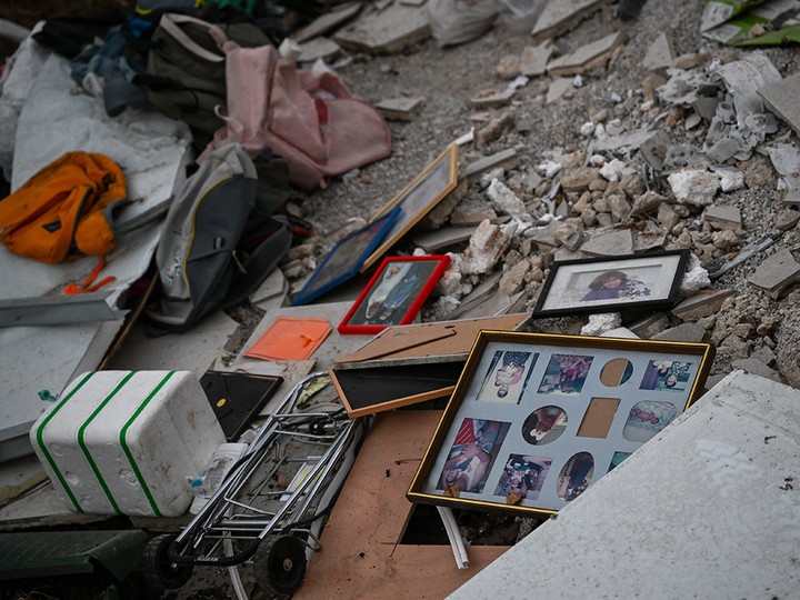  Family photos and personal items are scattered among the rubble of a destroyed house in Be’eri, Israel, near the border with Gaza on October 11, 2023.