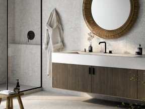 Stone walls and floors create a modern, spa-like feeling in principle bathrooms. Dekton Pietra Kode Sabbia ultra-compact surfacing, through designers, cosentino.com