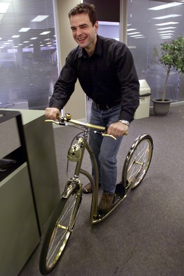 Martin Newland takes a bike in the National Post newsroom.