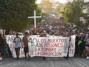 Migrants march towards the border with the United States in Tapachula, Chiapas State, Mexico, on Oct. 30, 2023.