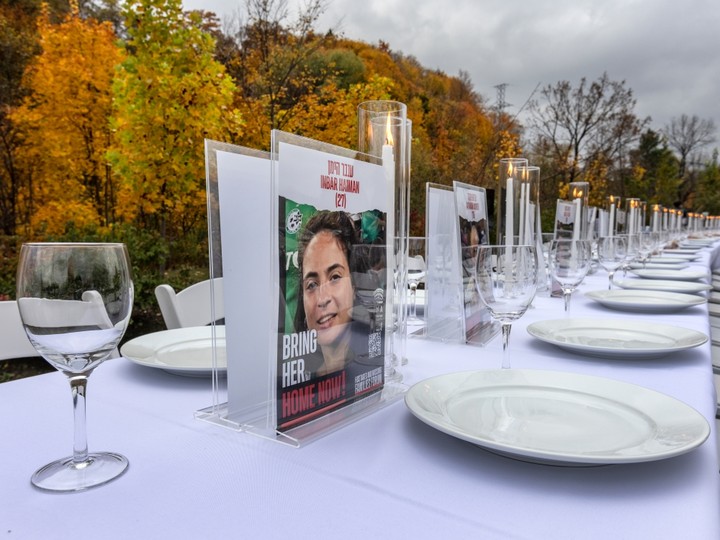  An image of Inbar Haiman is seen on an empty Shabbat table set up in Toronto on Friday to symbolize the more than 200 hostages taken by Hamas during the terrorist group’s Oct. 7 attack on Israel. Haiman, a 27-year-old from Haifa, Israel, was taken hostage at the Supernova music festival, where at least 260 festival-goers were slain. The table was installed by the UJA Federation of Greater Toronto as one in a series that have been set up in cities around the world to draw attention to the hostages in an effort to #bringthemhome.