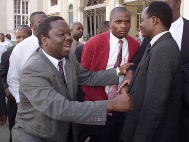 Morgan Tsvangirai greets supporters outside a Zimbabwe courthouse in 2001.