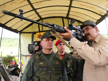 Nicolás Maduro, Venezuela’s president, shown with a gun during military exercises in 2017.