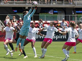 Canadian international Kailen Sheridan, who tied for the league lead with nine shutouts this season, is a finalist for NWSL goalkeeper of the year.&ampnbsp;San Diego Wave's Sheridan (1) saves a shot on goal during an NWSL soccer match against the Washington Spirit, in Washington, Saturday, May 6, 2023. THE CANADIAN PRESS/AP-Nathan Howard