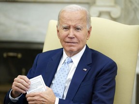 President Joe Biden listens as he holds a meeting to receive a briefing on Ukraine in the Oval Office of the White House, Thursday, Oct. 5, 2023, in Washington.