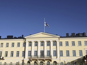 Finnish flag flutters on half-mast at the Presidential Castle in Helsinki, Finland, Monday Oct. 16, 2023. Martti Ahtisaari, former Finnish president and Nobel Peace Prize winner, has died at 86.