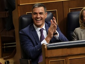 Acting Prime Minister Pedro Sanchez applauds at the Spanish parliament's lower house in Madrid, Spain on Friday, Sept. 29, 2023. The leader of Spain's conservatives on Friday failed for the second time in three days to get parliamentary support for his bid to become prime minister following his party's victory in a national election.