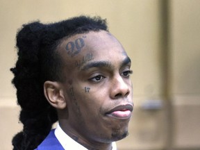 FILE - Jamell Demons, also known as rapper YNW Melly, waits in the courtroom for a question from the jury as they deliberate at the Broward County Courthouse in Fort Lauderdale, Fla., on Saturday, July 22, 2023. Florida prosecutors have charged Demons, on Monday, Oct. 2, 2023, with witness tampering in advance of his retrial on double murder charges even as his attorneys accused them of conspiring to hide evidence that the lead detective may have lied in a related investigation.