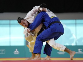 Canada's Shady El Nahas takes down Chile's Thomas Briceno during the men's 100kg judo gold medal match at the Pan American Games, in Santiago, Chile, Monday, Oct. 30, 2023.